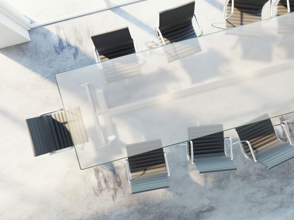 Glass conference table with black modern chairs